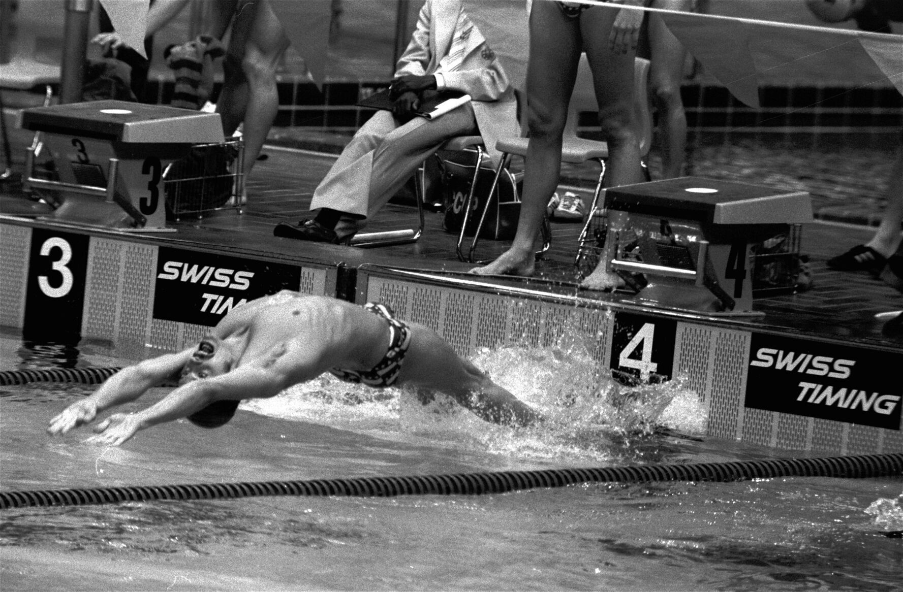 1976: John Naber becomes first to break 2-minute barrier in 200-meter backstroke
